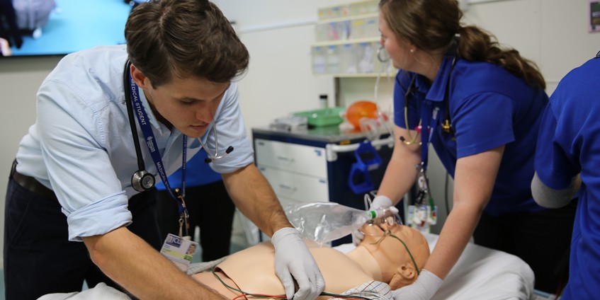 Medical students train on a human body simulator