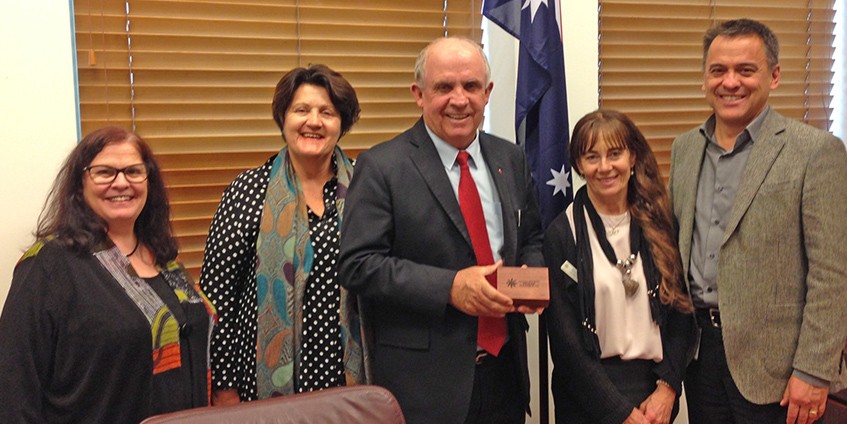 Senator John Williams is presented with a farewell gift from Alliance delegation (L to R) Dorothy Coombe, Geri Malone, Janine Snowie and Chris Bourke. Photo NRHA  