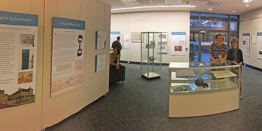 A/Prof Kath Weston and A/Prof Louella McCarthy, curators of the Caring for the Incarcerated exhibition about the history of prison medicine. The exhibition was held at the University of Wollongong in 2017