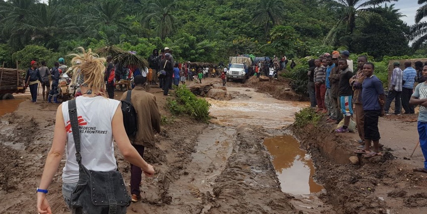 Lisa Searle crossing muddy roads in Baraka