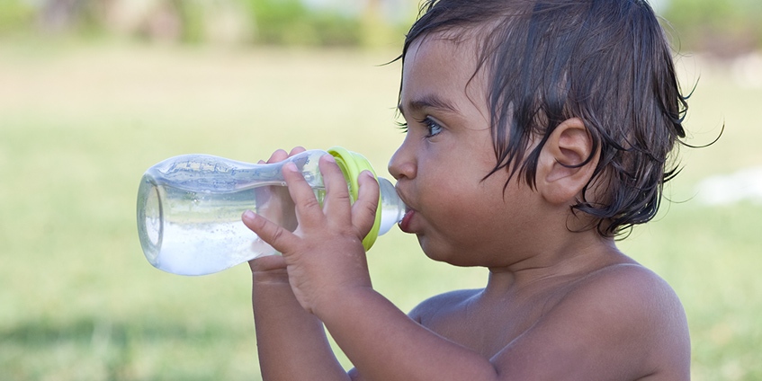 Young child drinking water