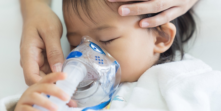 infant using a breathing mask