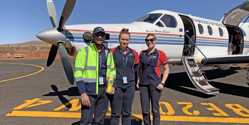 (L-R) Senior Dentist Vaibhav Garg, Dental Assistant Nicole Hearps and Program Co-ordinator Kelly Fargher arriving in Kintore, NT for a week-long clinical trip