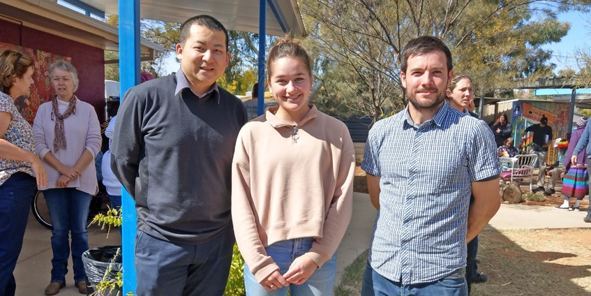 Emma Buttolph with pharmacists Danny Tsai (l) and Tobias Spears (r) at Purple House