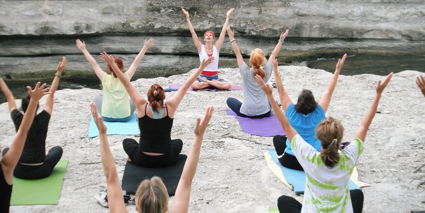 Female yoga class outdoors
