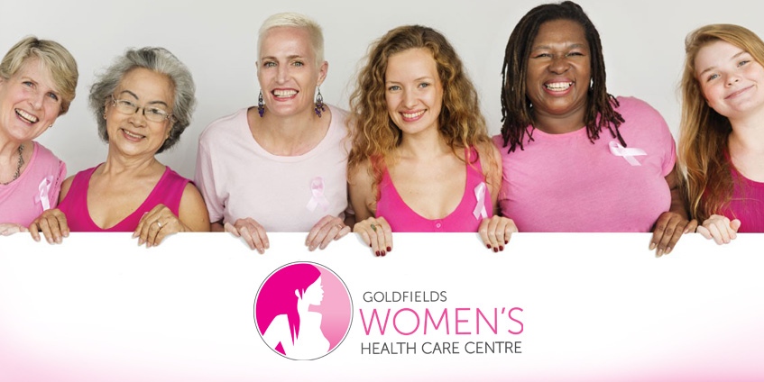Women holding sign with Goldfields Women’s Health Care Centre logo