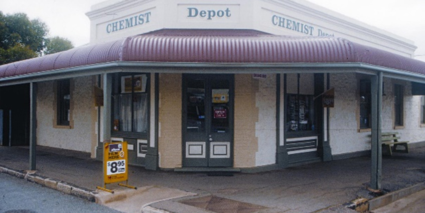 Rural pharmacy older styled building on street corner