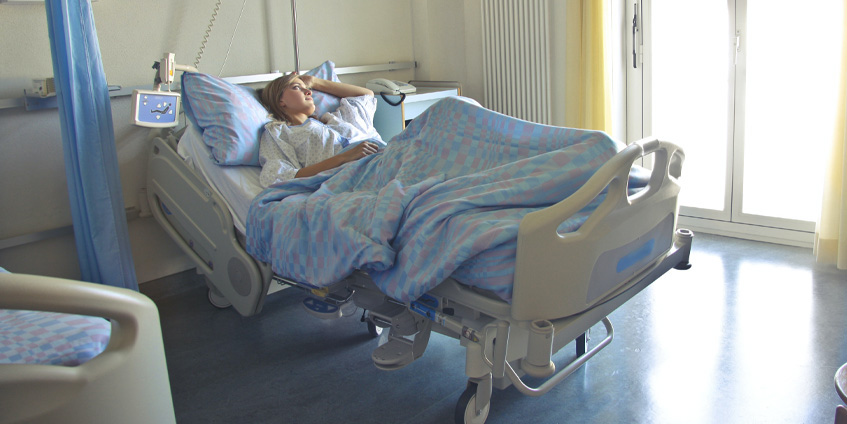 Woman in hospital bed