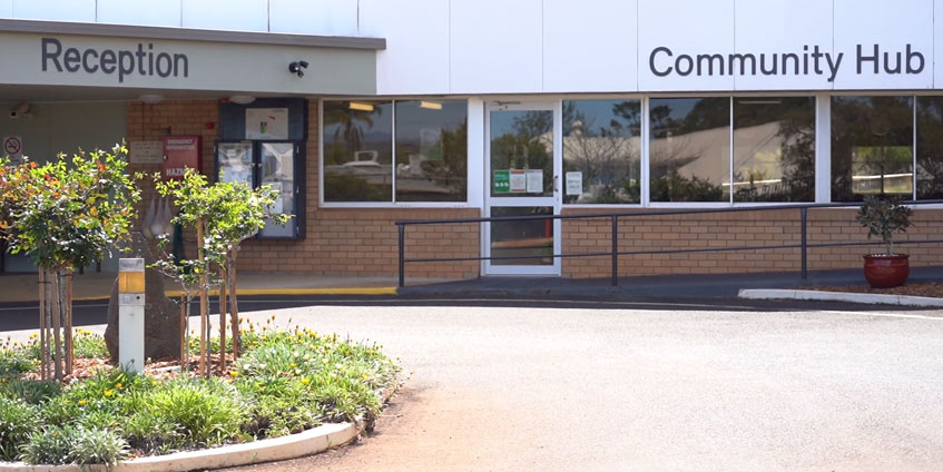 Building with Community Hub and Reception signage
