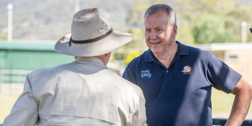 Rural Aid counsellor Gary Bentley meets with a farmer.