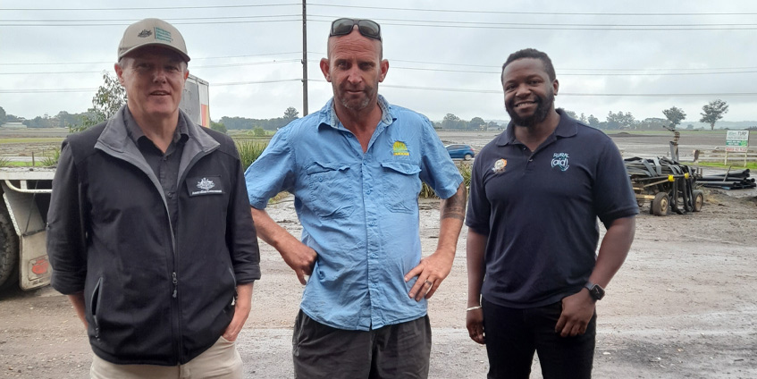 Rural Aid's Gome Simfukwe (far right) inspects flood damage on the Hawkesbury. [Image: Gome Simfukwe]