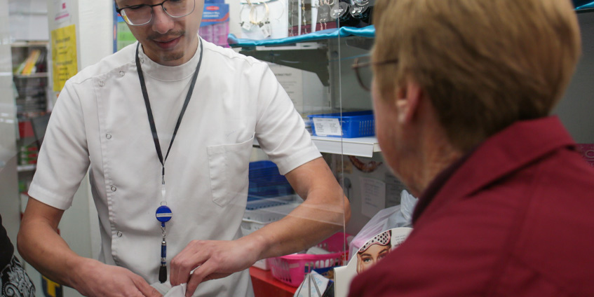Pharmacist with customer