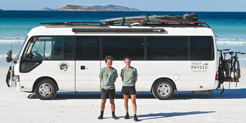 Clare and David – physiotherapists in front of their bus