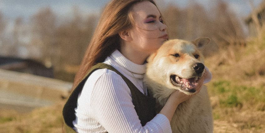 Woman holding dog