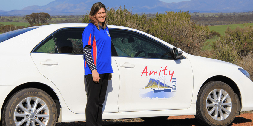 Anita is pictured next to the Amity Health car