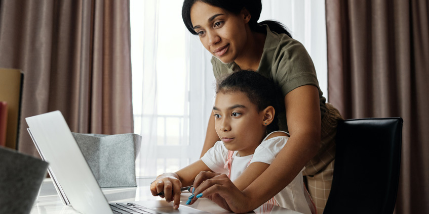 Mother and daughter on laptop