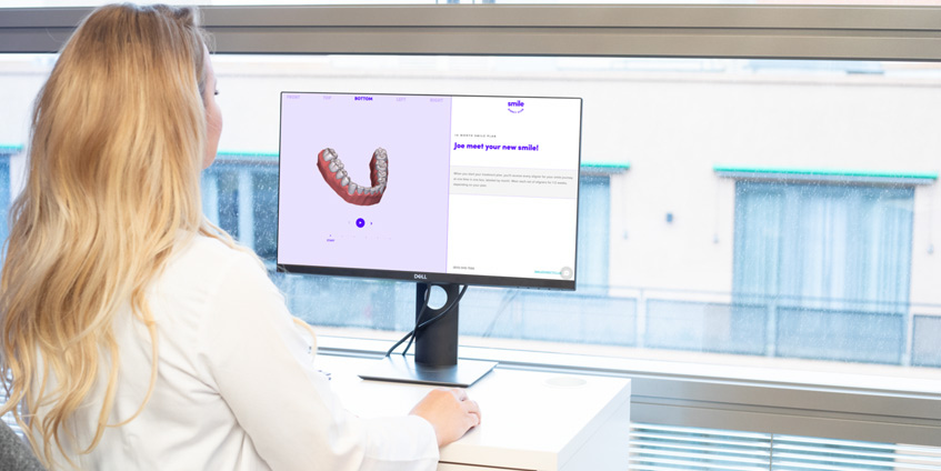 Woman using dental software