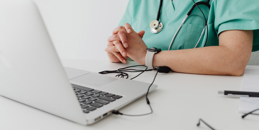 Medical professional using laptop
