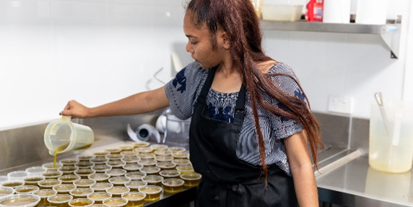 Tamara Stewart pouring Bush Balm [Image: Emma Murray]