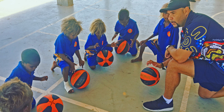 Timmy Duggan with Hoops 4 Health young participants