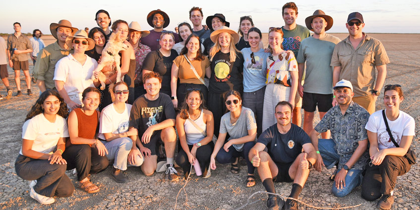Large group of students out on a dry lake bed