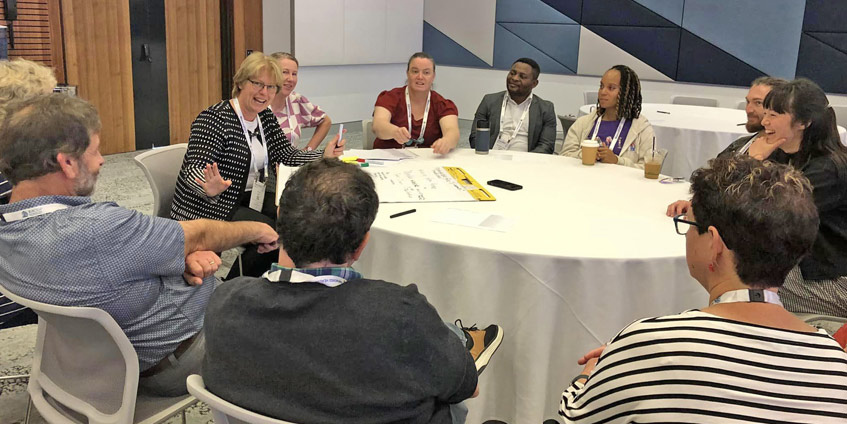 Group of doctors seated at a round table