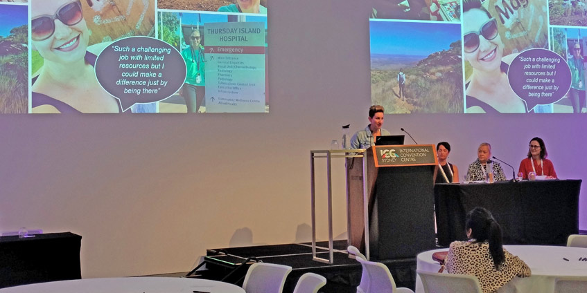 Female doctor presenting to audience at the conference