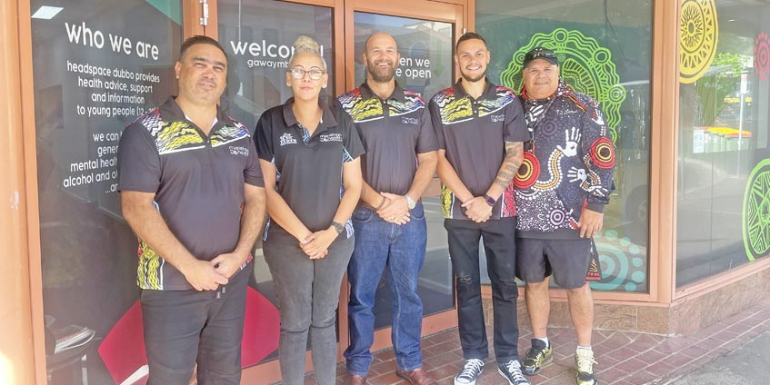 Image: Left to right: Brendan Cubby – Acting Program Manager Youth Outreach Project, Brenda Duncan – Community Engagement Officer, Tim Carr – Training and Engagement Officer, Travis Hill – Community Engagement Officer, Max Hill – Community Engagement Officer. 
