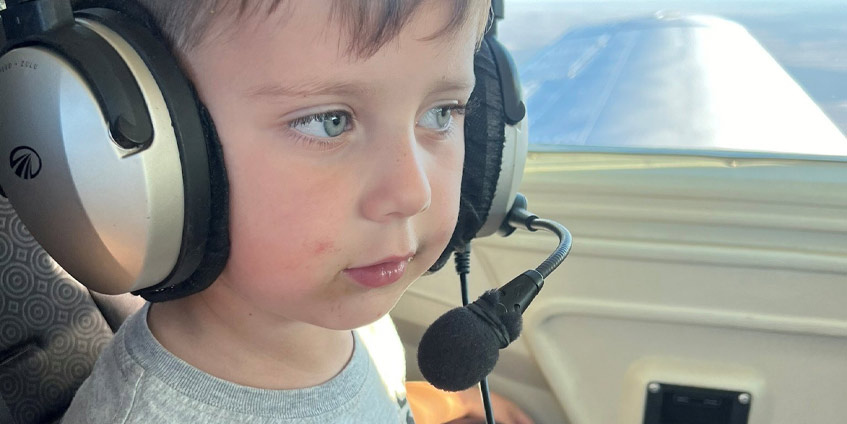 Nate on Angel Flight wearing a headset