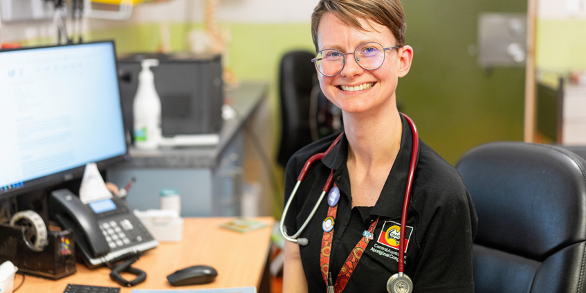 Dr Sophie Collins at her desk