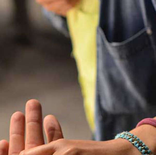 Man taking something from another hand