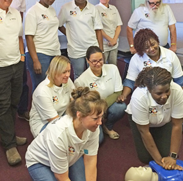 Gp of people demonstrating CPR