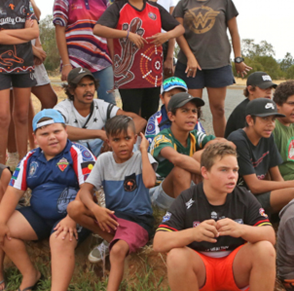 Group of children talking to music video director
