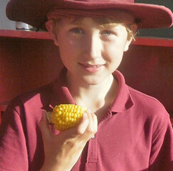 A Lower Hume primary school student enjoys barbequed vegetables