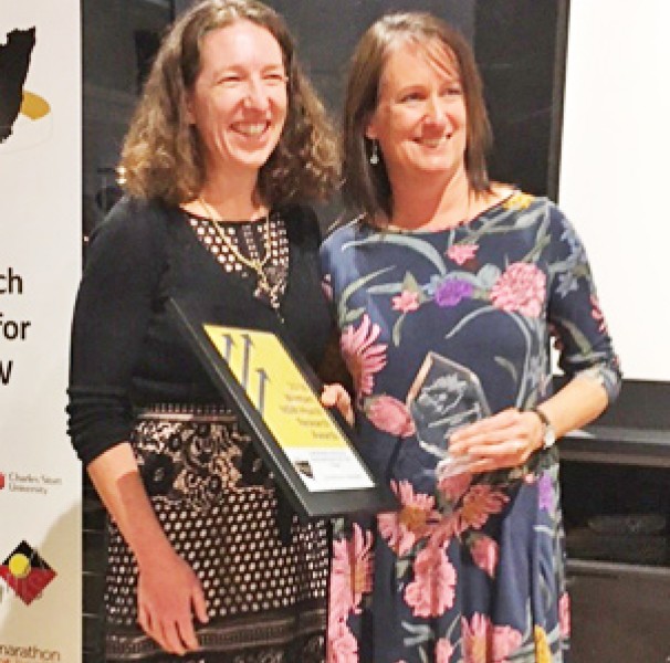 Catherine Bourke receiving the 2018 Emerging Researcher of the Year award at the WHRN Conference