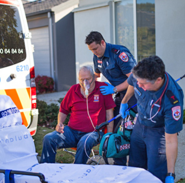 Paramedics with older male patient