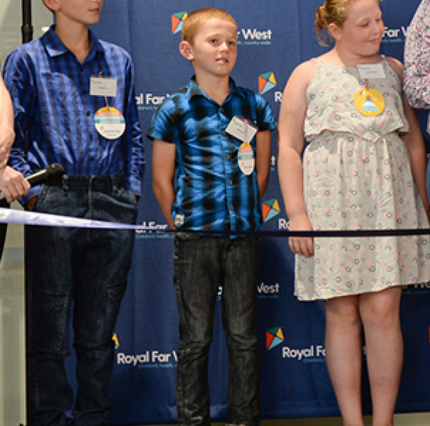 At the opening ceremony MC Daniel Gibson from Prime7 Television interviews a client family from Gunnedah. (L-R) Royal Far West Social Worker Verity Ashover, Thomas, Tyler, Kellyann and Caroline Earl, Daniel Gibson