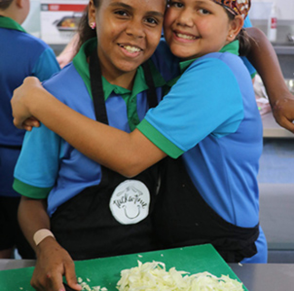 Two girls preparing food