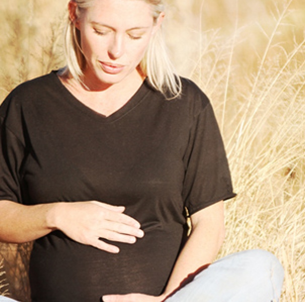 pregnant woman in a field 
