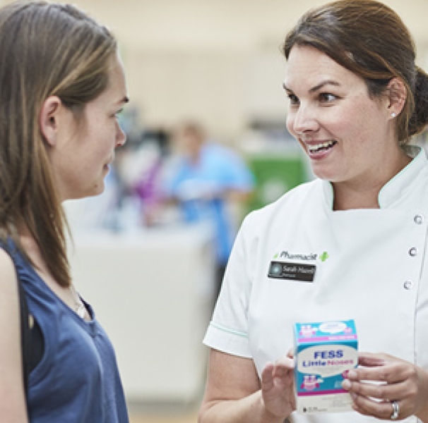 female pharmacy staff with customer