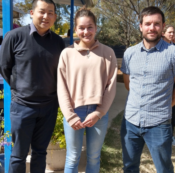 Emma Buttolph with pharmacists Danny Tsai (l) and Tobias Spears (r) at Purple House