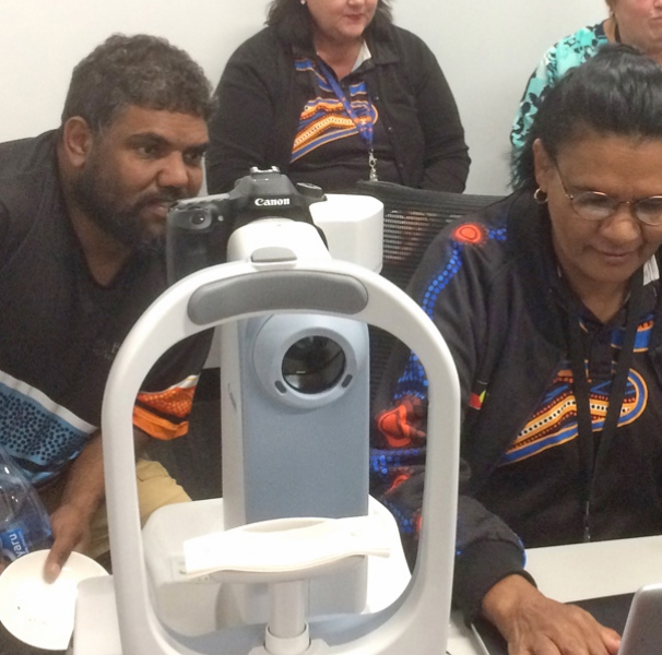 People looking at retinal scans
