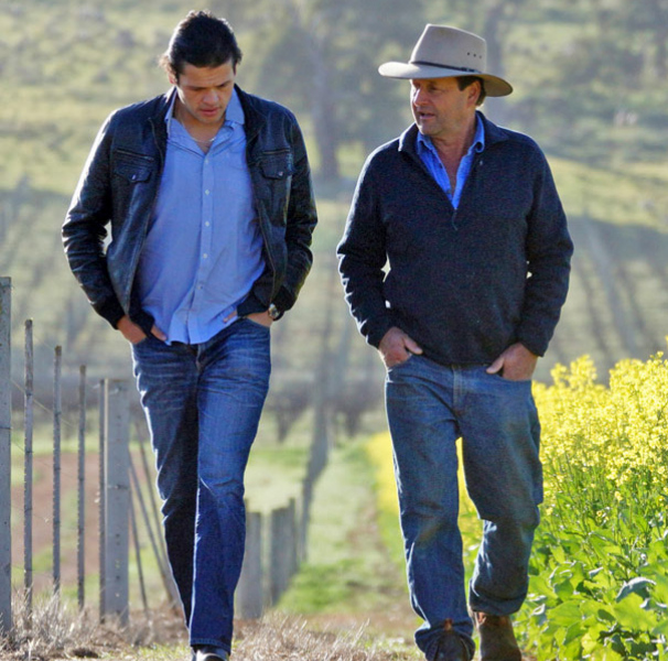 Two men walking on a farm