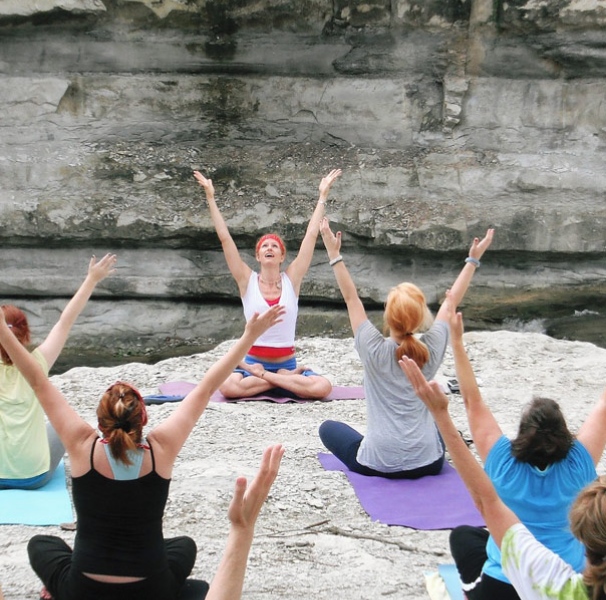 Female yoga class outdoors