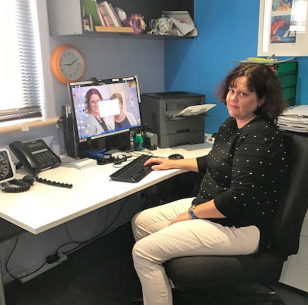 Dr Emma Keeler at her desk