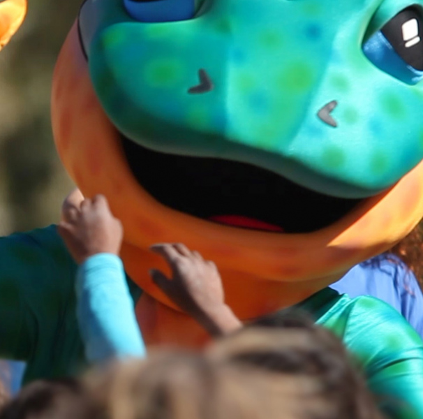 Milpa the trachoma goanna supporting ‘Clean Faces, Strong Eyes’ health promotion messaging at an AFL game in Alice Springs NT.