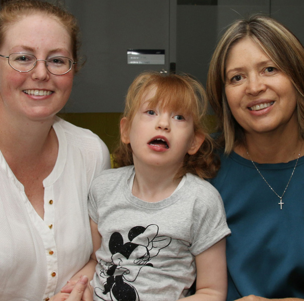 Dr Tracy Dudding-Byth with Ainsely Hayes and her daughter Charleigh.