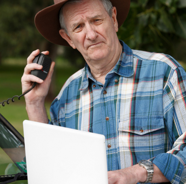 Male farmer with laptop