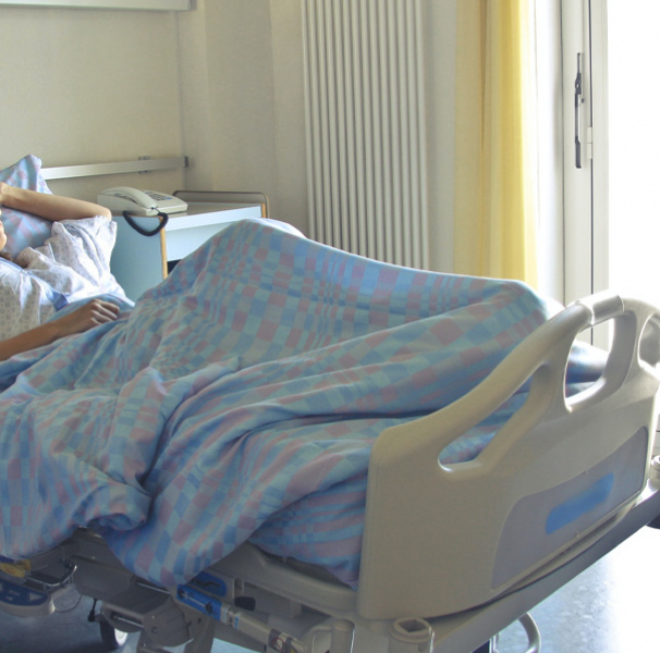 Woman in hospital bed