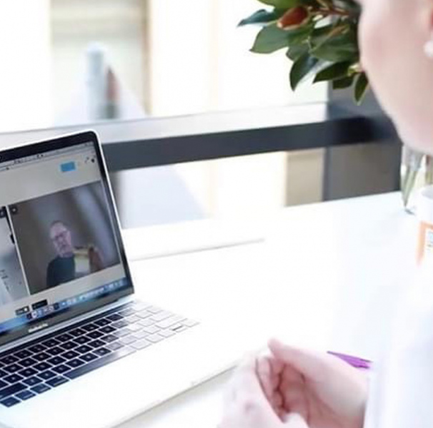 Woman using laptop for telehealth